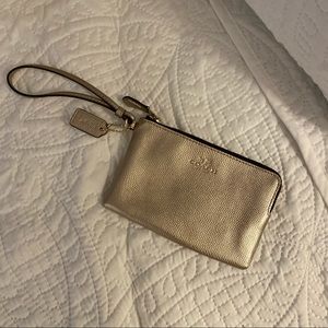 🍾 champagne gold COACH wristlet